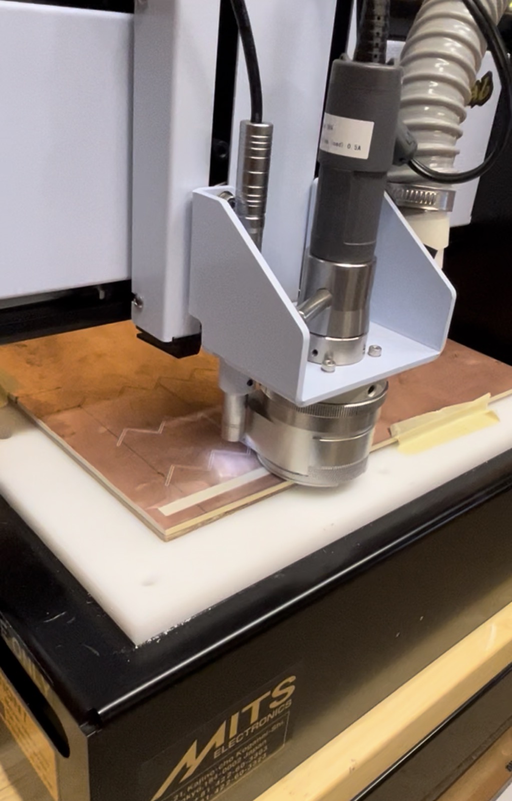 CNC PCB milling machine fabricating copper circuit board
